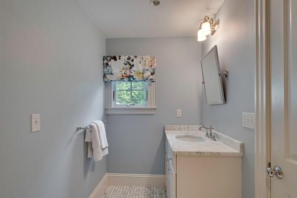 24 Birch Road Wellesley, MA 02482 - Photo 32 of 39 a bathroom with a sink toilet and mirror