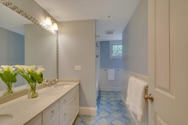 24 Birch Road Wellesley, MA 02482 - Photo 33 of 39 a bathroom with a granite countertop sink a mirror and a shower