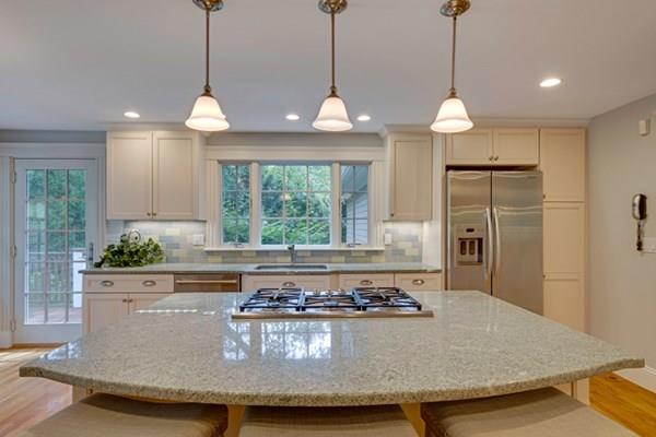 24 Birch Road Wellesley, MA 02482 - Photo 4 of 39 a view of a kitchen with kitchen island stainless steel appliances granite countertop a stove and a sink