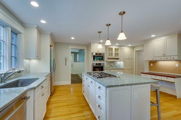 24 Birch Road Wellesley, MA 02482 - Photo 7 of 39 a kitchen with kitchen island granite countertop a stove and a sink