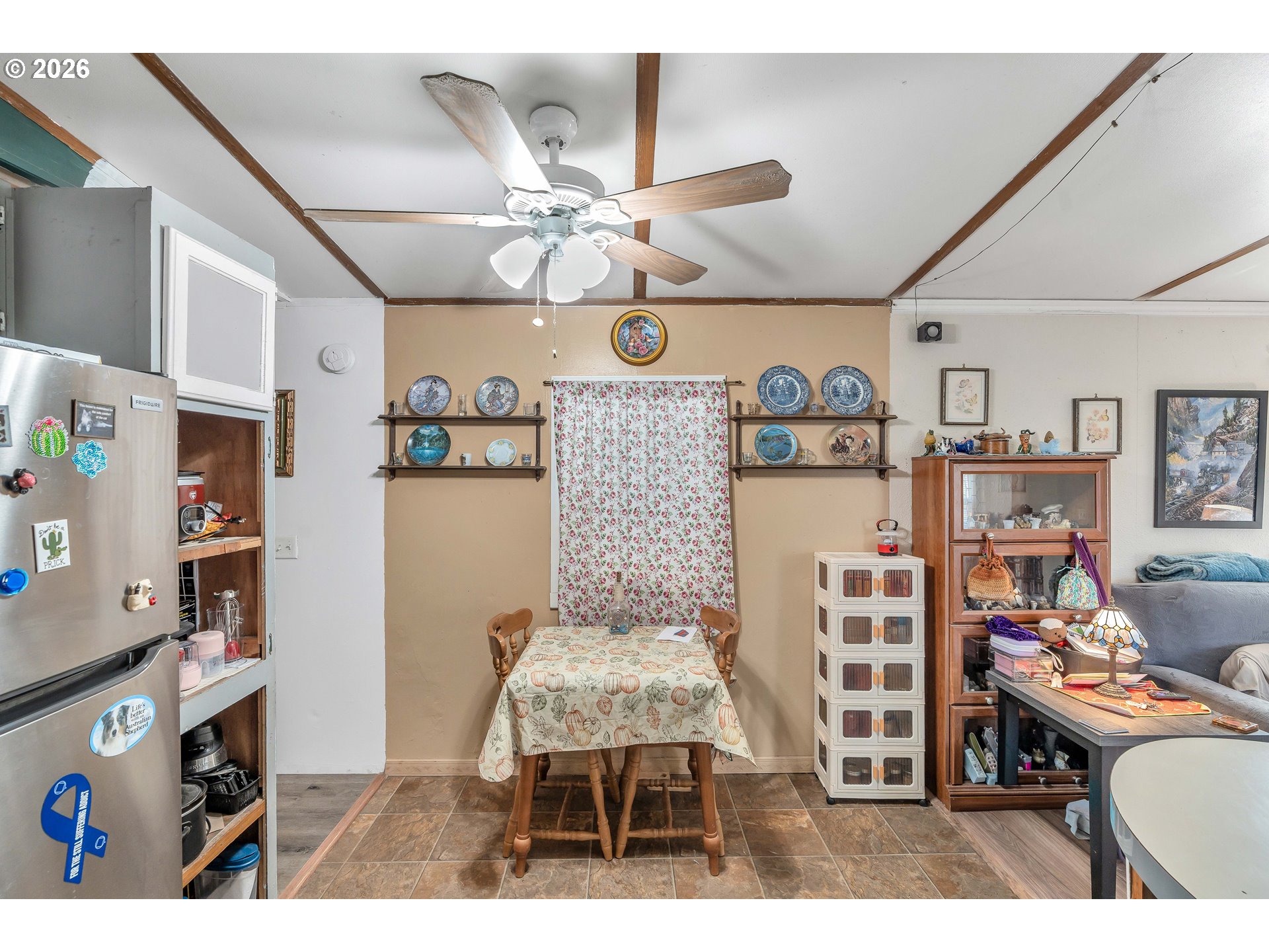 10038 South New Era Road, Unit 25 Canby, OR 97013 - Photo 11 of 39 a living room with furniture and a flat screen tv