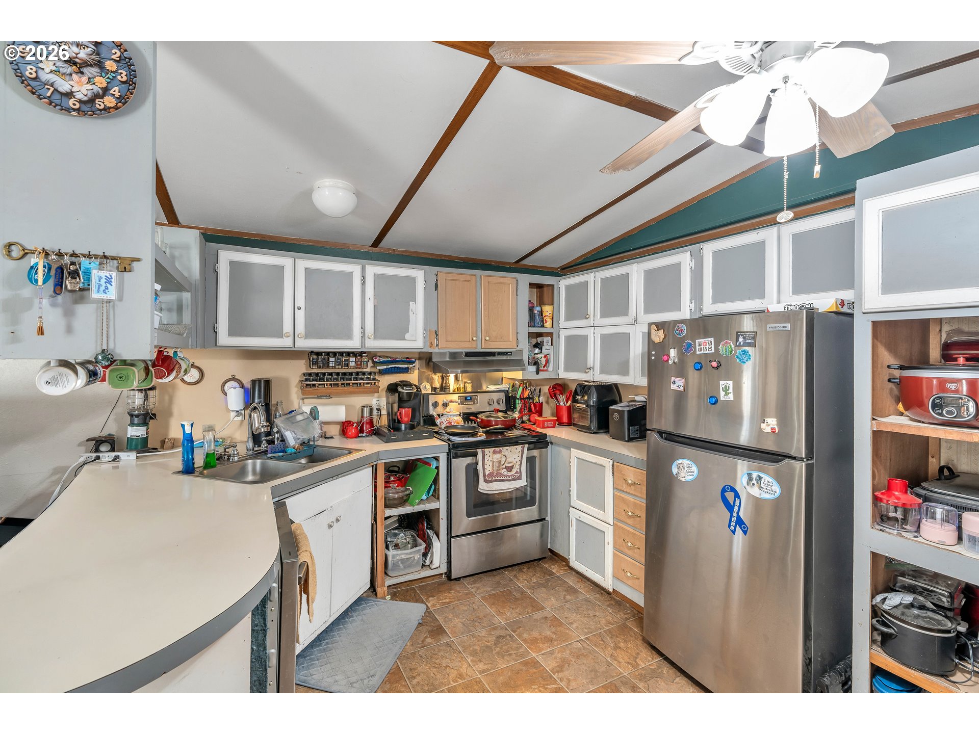 10038 South New Era Road, Unit 25 Canby, OR 97013 - Photo 13 of 39 a kitchen with stainless steel appliances granite countertop a refrigerator and a stove top oven