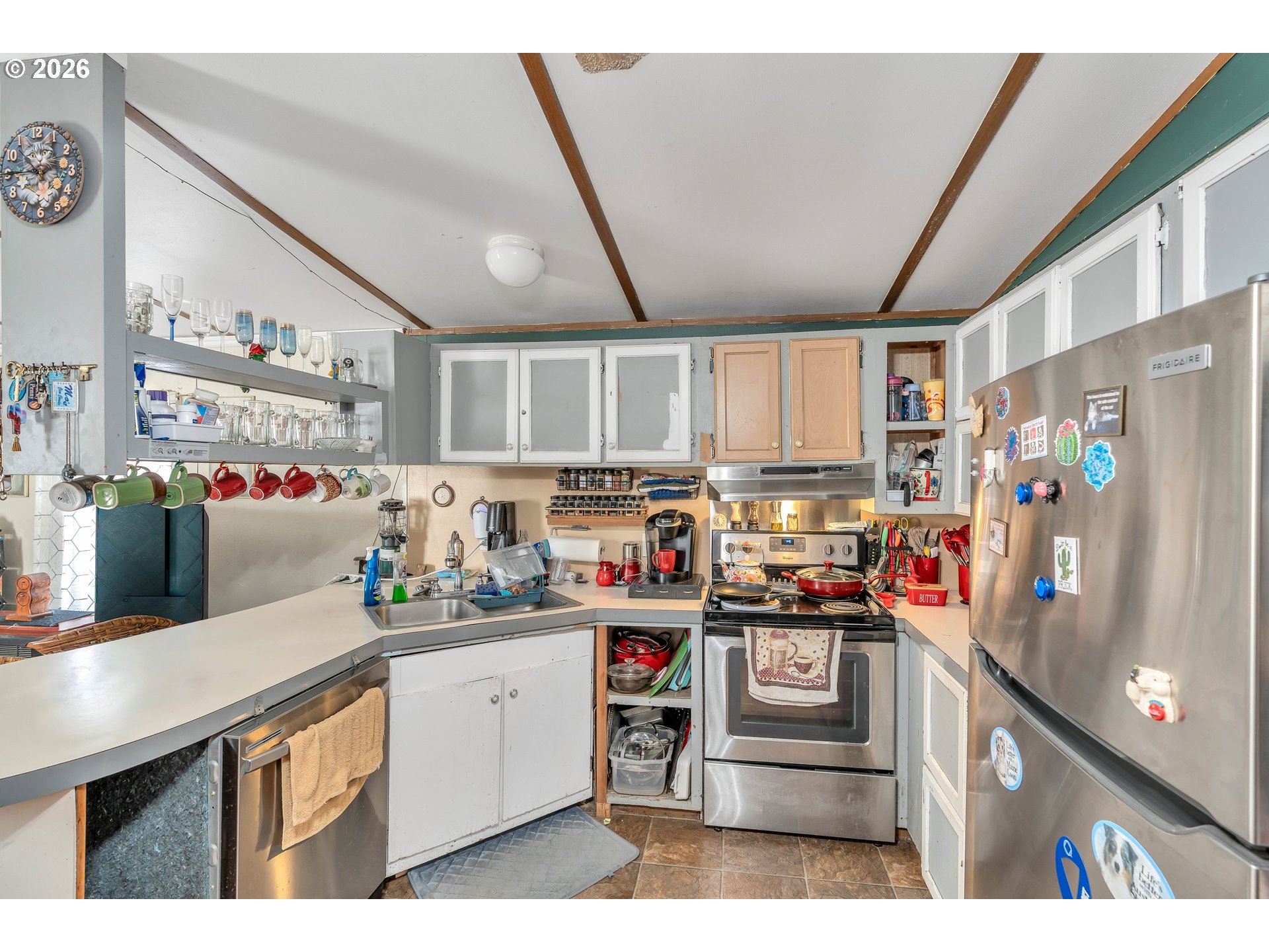 10038 South New Era Road, Unit 25 Canby, OR 97013 - Photo 14 of 39 a kitchen with stainless steel appliances granite countertop a sink and cabinets