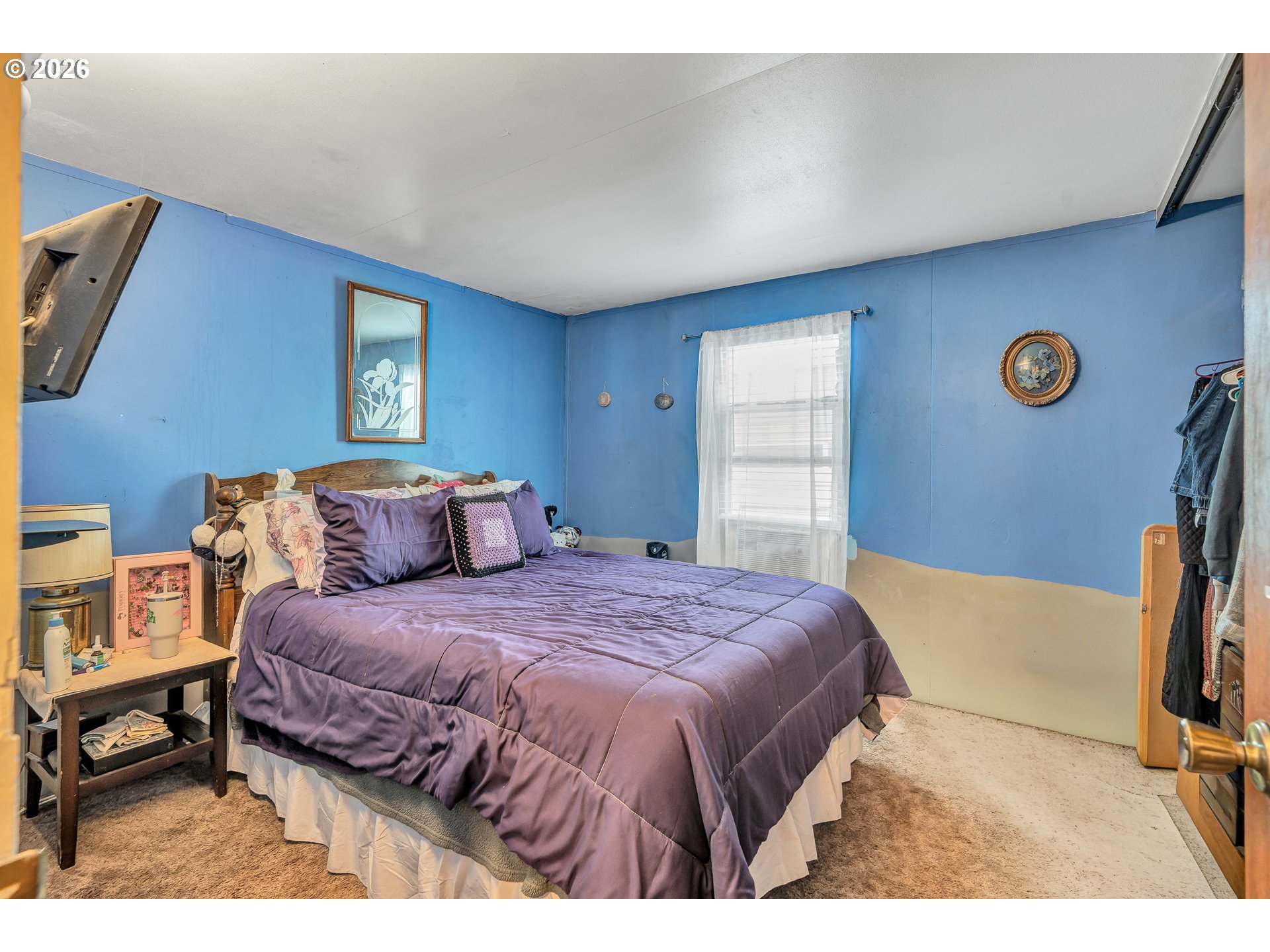 10038 South New Era Road, Unit 25 Canby, OR 97013 - Photo 22 of 39 a bedroom with a bed and a window