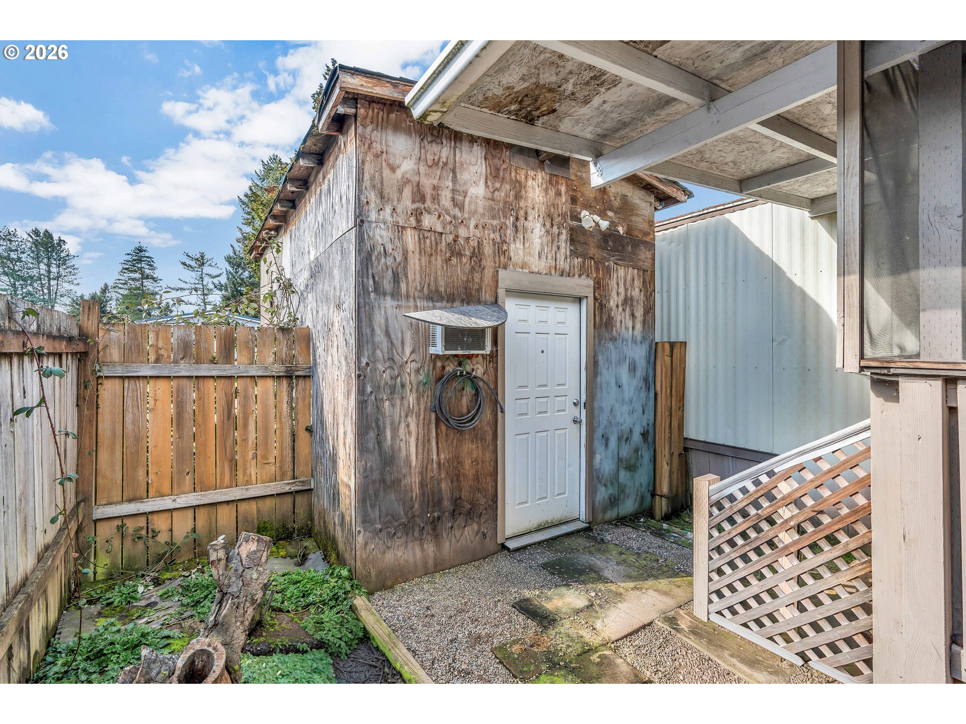 10038 South New Era Road, Unit 25 Canby, OR 97013 - Photo 26 of 39 a view of a house with a wooden fence