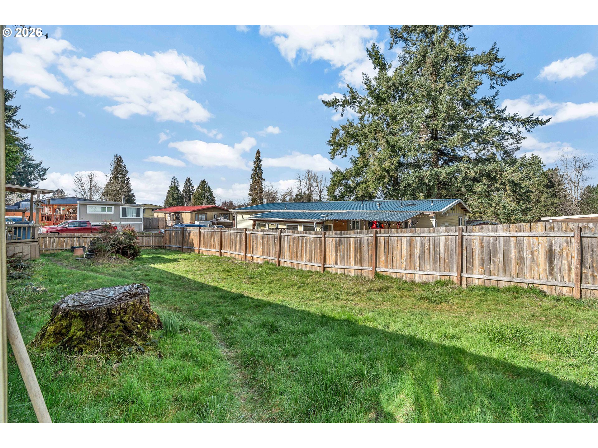 10038 South New Era Road, Unit 25 Canby, OR 97013 - Photo 32 of 39 a view of a house with a yard and sitting area