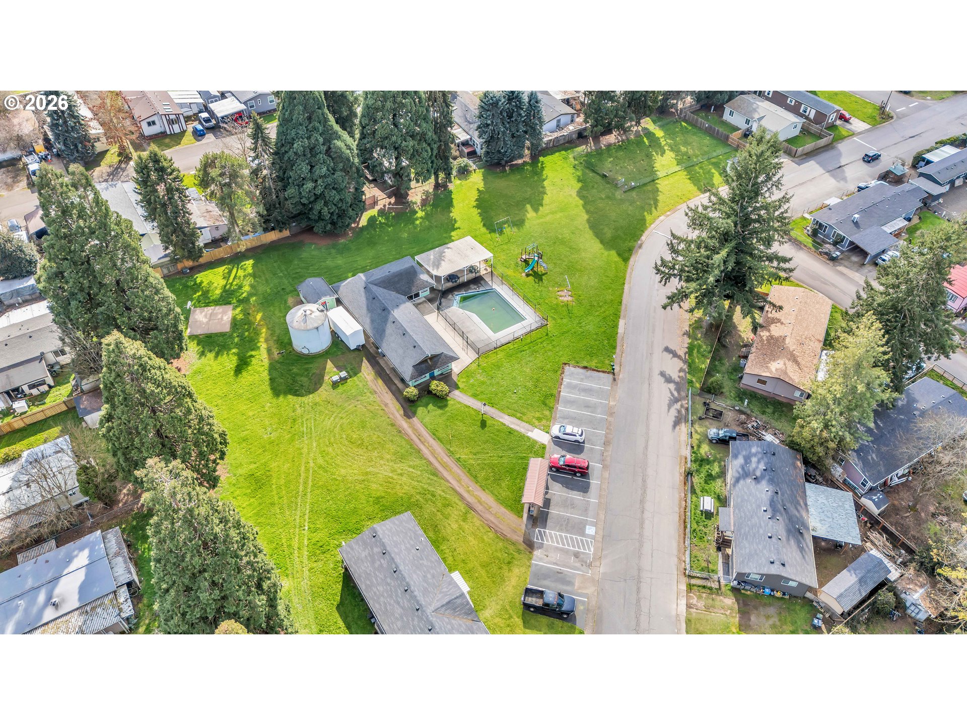 10038 South New Era Road, Unit 25 Canby, OR 97013 - Photo 34 of 39 an aerial view of a house with a garden and swimming pool