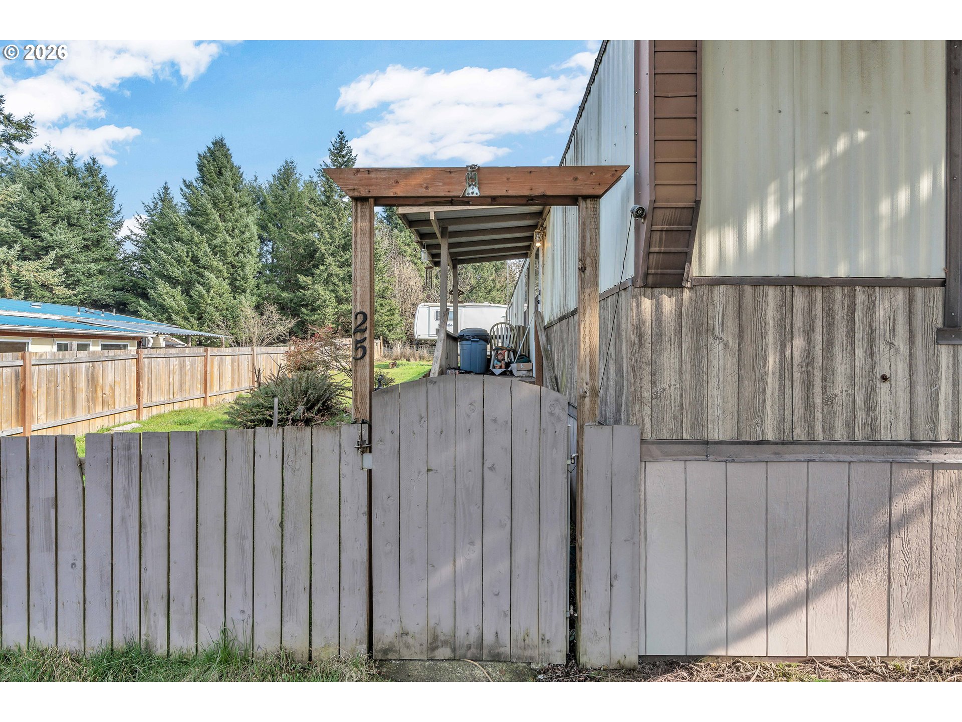 10038 South New Era Road, Unit 25 Canby, OR 97013 - Photo 4 of 39 a view of a house with wooden fence