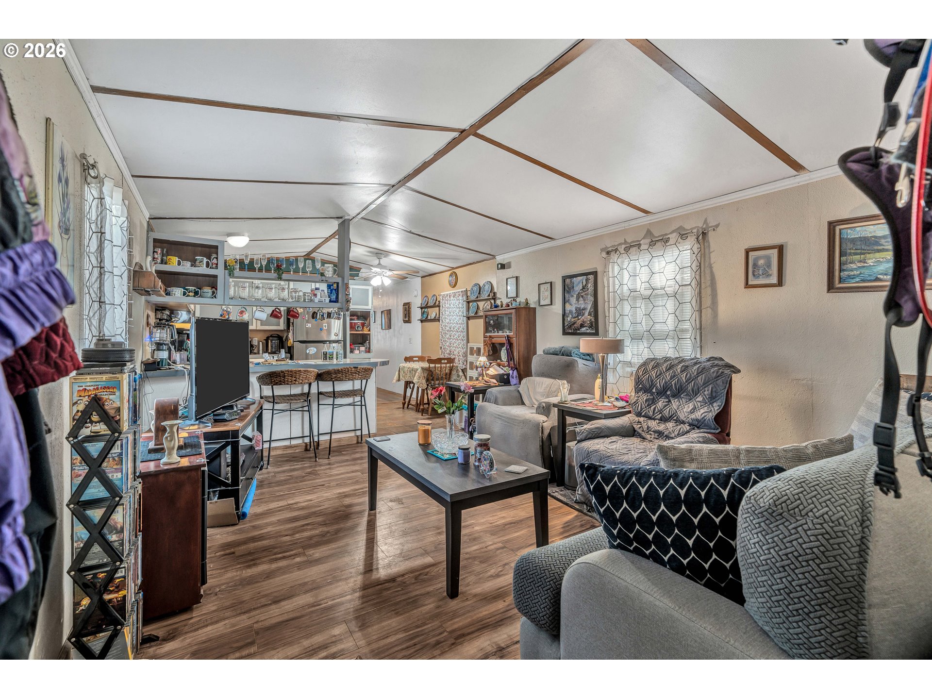 10038 South New Era Road, Unit 25 Canby, OR 97013 - Photo 7 of 39 a living room with furniture and a wooden floor