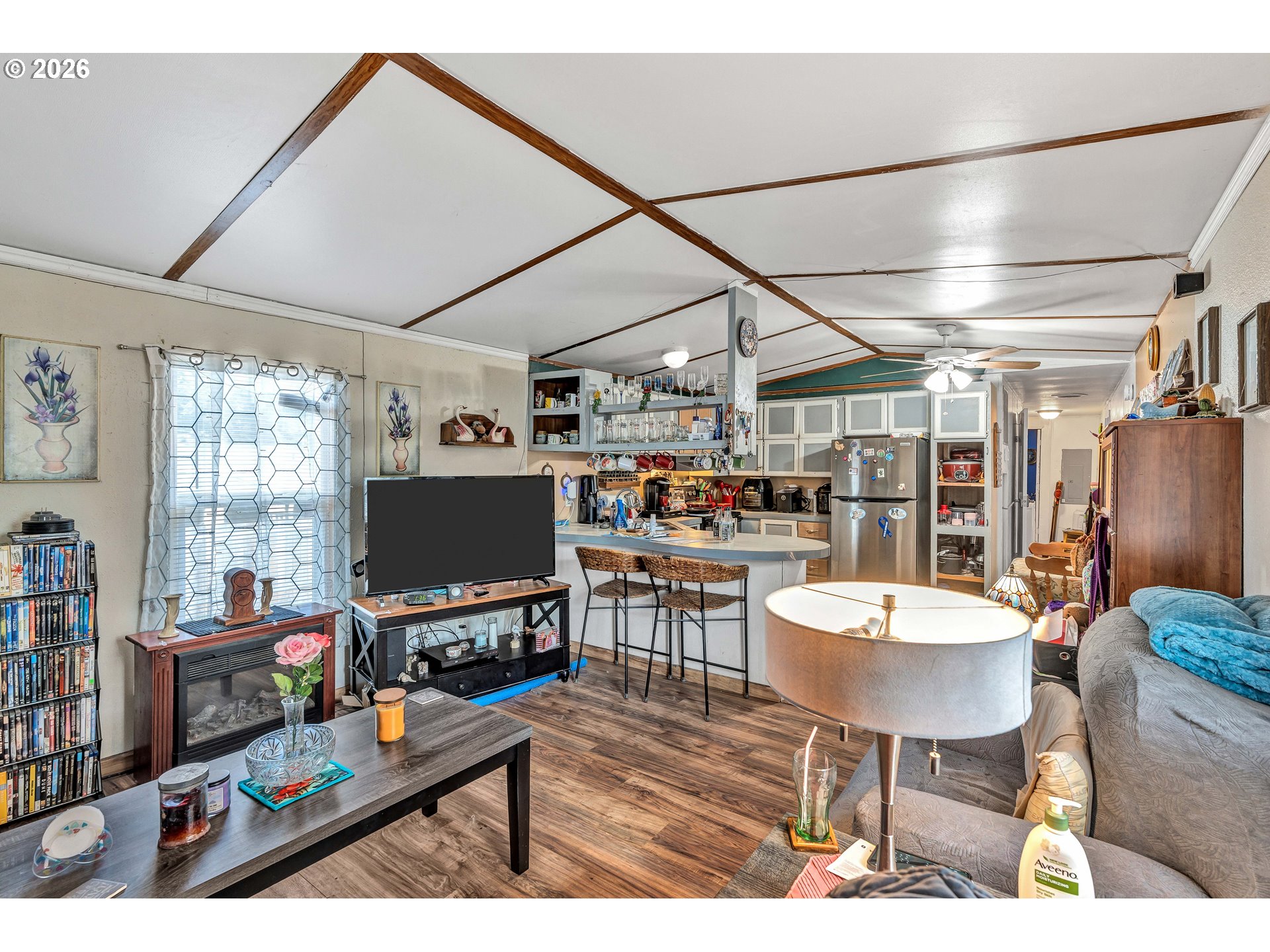 10038 South New Era Road, Unit 25 Canby, OR 97013 - Photo 8 of 39 a living room with lots of furniture and a flat screen tv