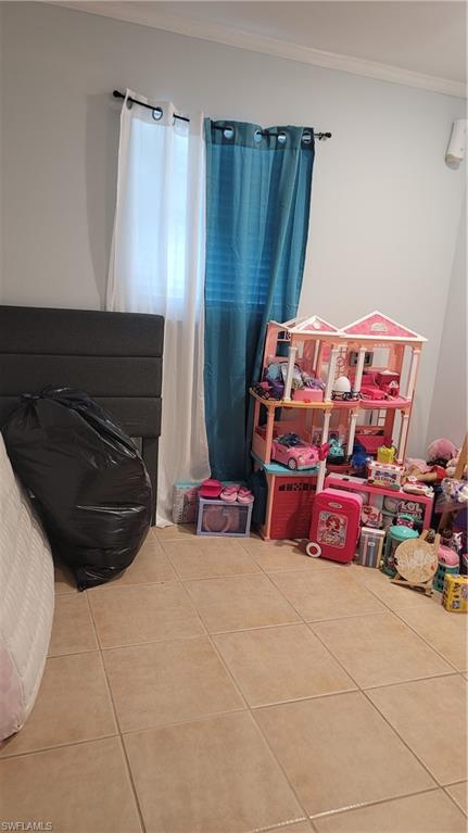 2172 45th Street Southwest Naples, FL 34116 - Photo 22 of 26 a bedroom with an bunk bed and a couch