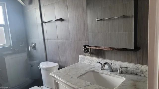 a bathroom with a sink and toilet