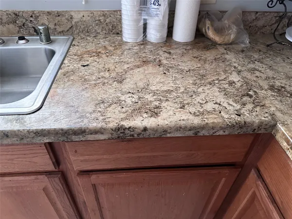 a view of a dining room with furniture and window
