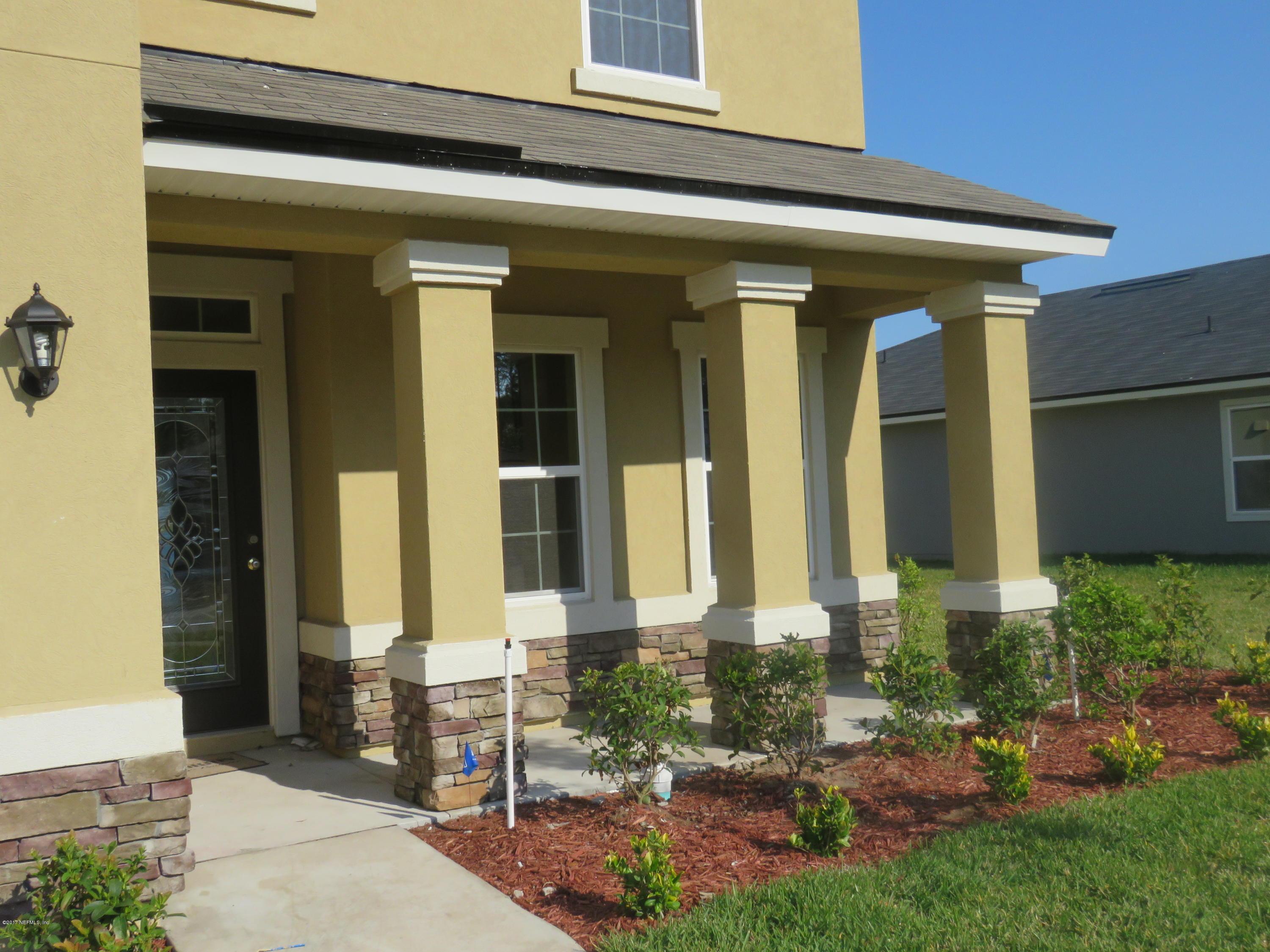 516 Deer Crossing Road St. Augustine, FL 32086 - Photo 14 of 43 front view of a house with a yard