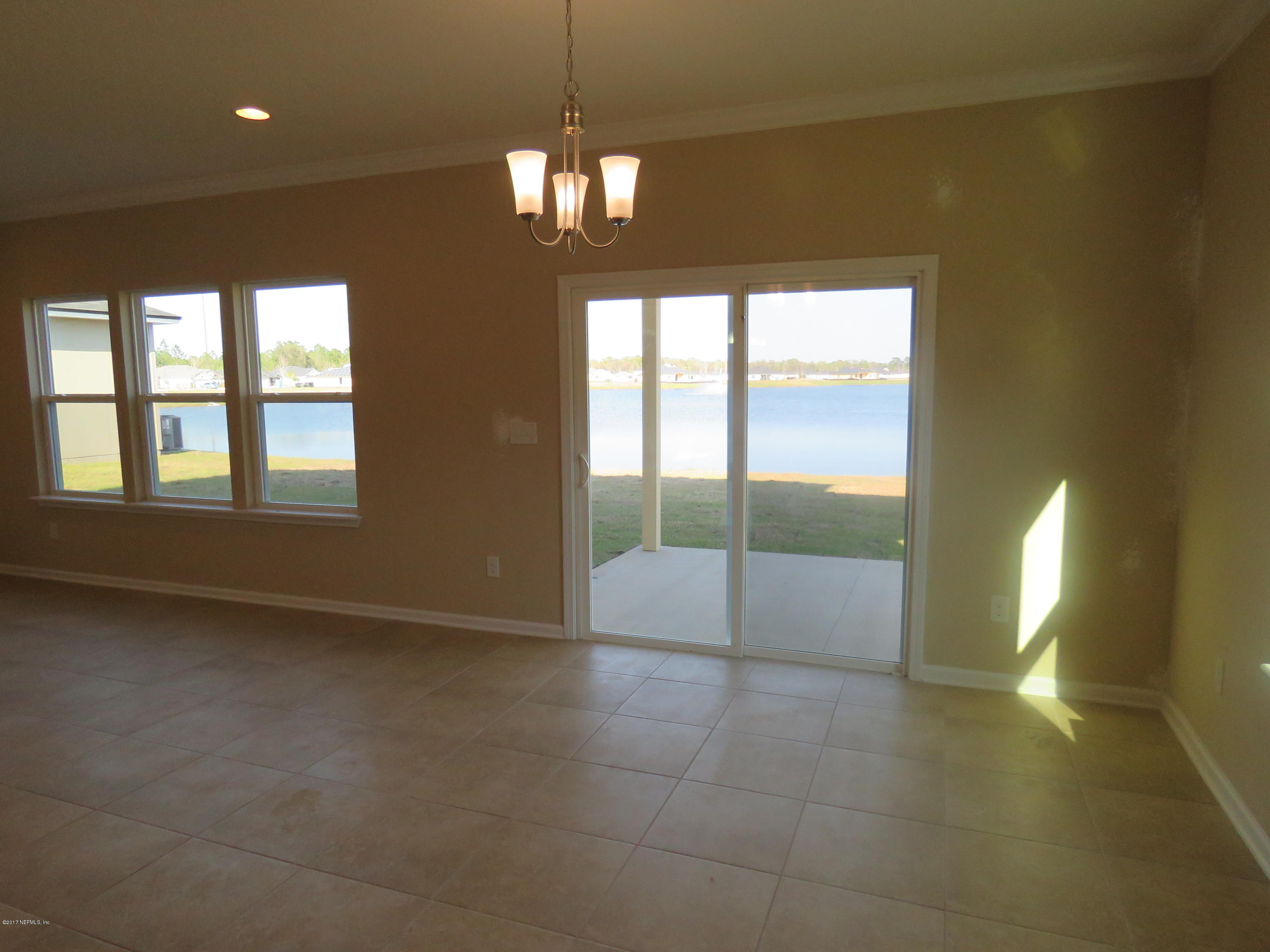 516 Deer Crossing Road St. Augustine, FL 32086 - Photo 20 of 43 a view of an empty room with glass door