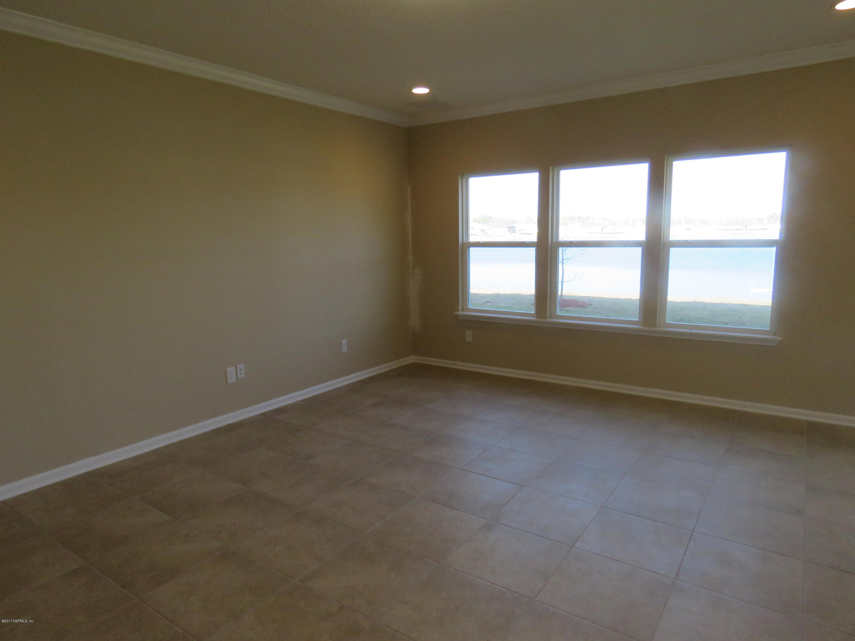 516 Deer Crossing Road St. Augustine, FL 32086 - Photo 23 of 43 an empty room with a windows
