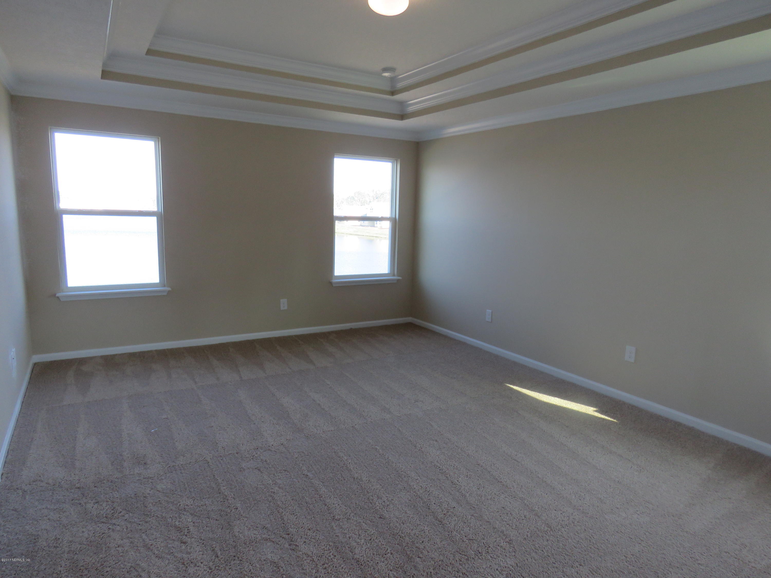 516 Deer Crossing Road St. Augustine, FL 32086 - Photo 35 of 43 an empty room with a window