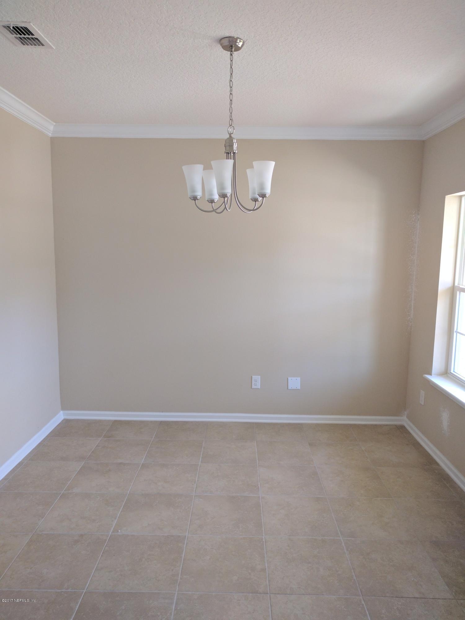 516 Deer Crossing Road St. Augustine, FL 32086 - Photo 3 of 43 a view of an empty room with a window