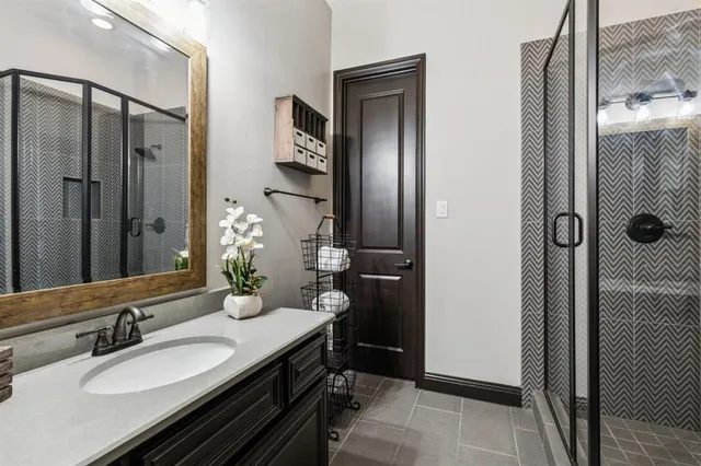 a bathroom with a double vanity sink and mirror