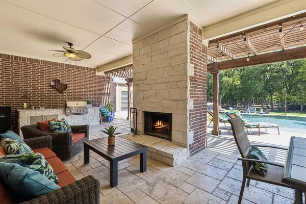 a outdoor living space with a couch and a table