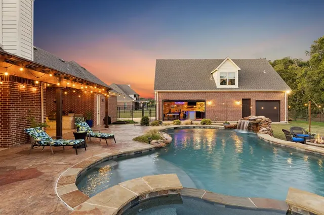 a view of a swimming pool with chairs
