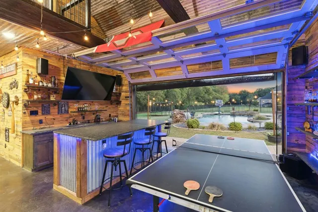 a open kitchen with stainless steel appliances granite countertop a stove and a sink