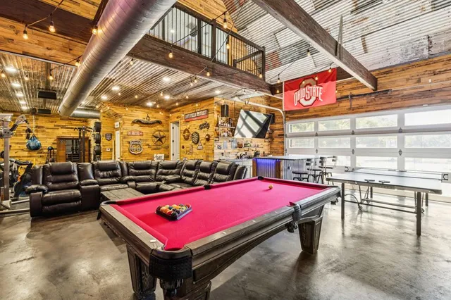 a room with pool table and a table