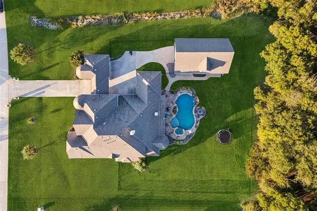 an aerial view of a house with a garden