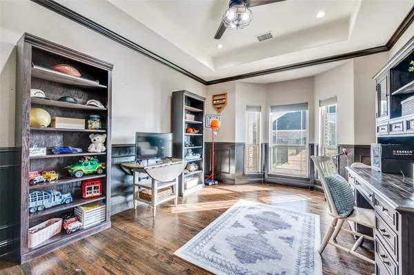 a kitchen with a sink and chairs