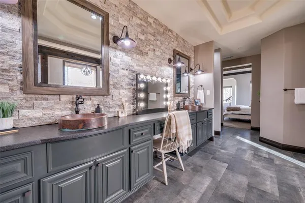 a living room with furniture and a ceiling fan