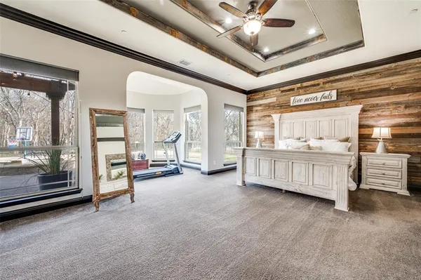 a spacious bathroom with a tub shower and a sink