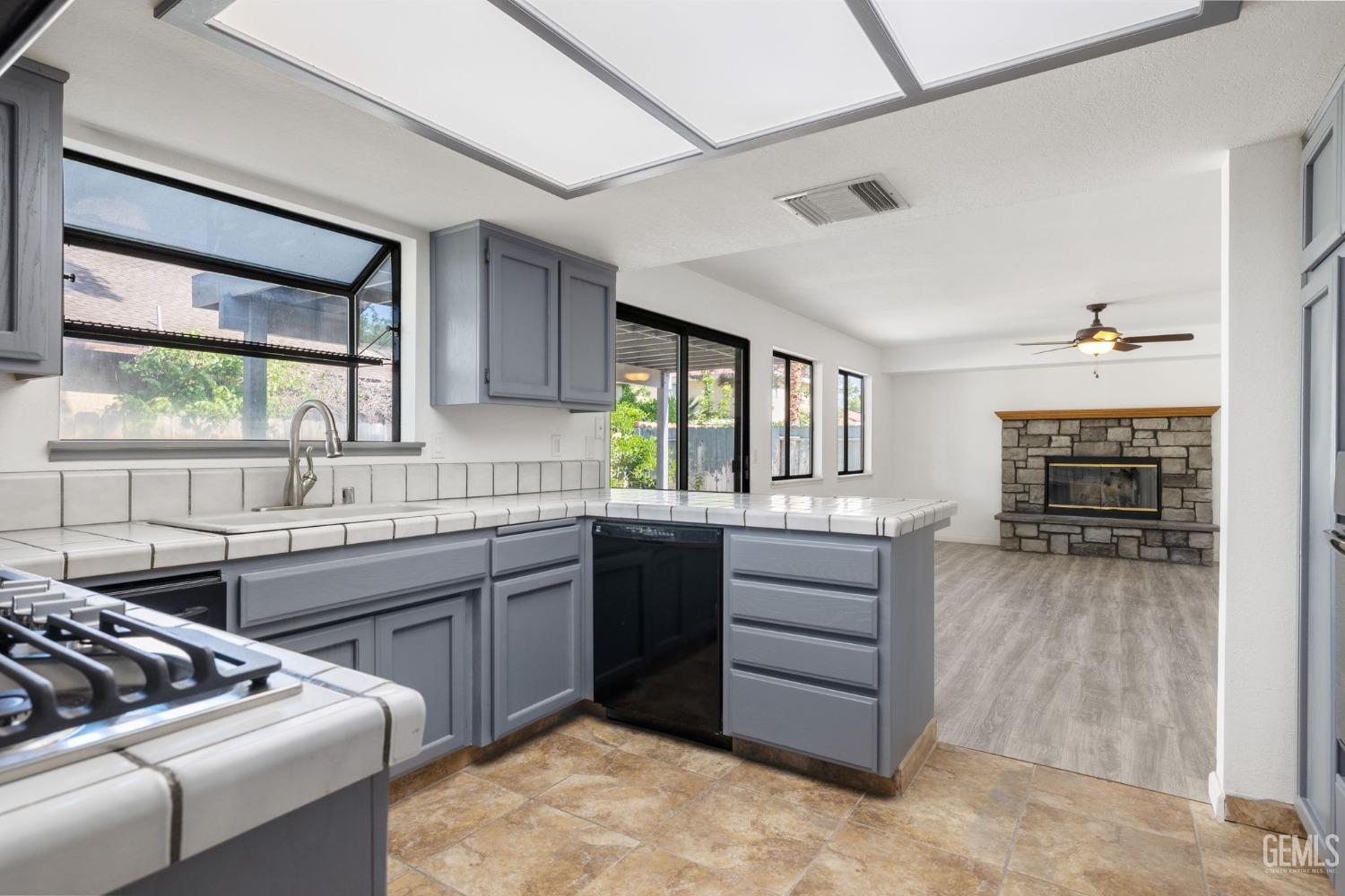 Undisclosed Address Ridgecrest, CA 93555 - Photo 11 of 34 a kitchen with sink cabinets and window