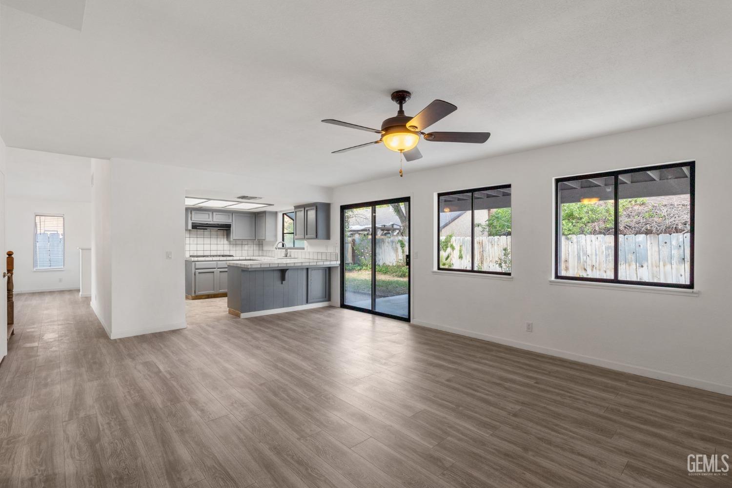 Undisclosed Address Ridgecrest, CA 93555 - Photo 14 of 34 a view of an empty room with a window and wooden floor