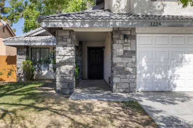 a front view of a house with a outdoor space