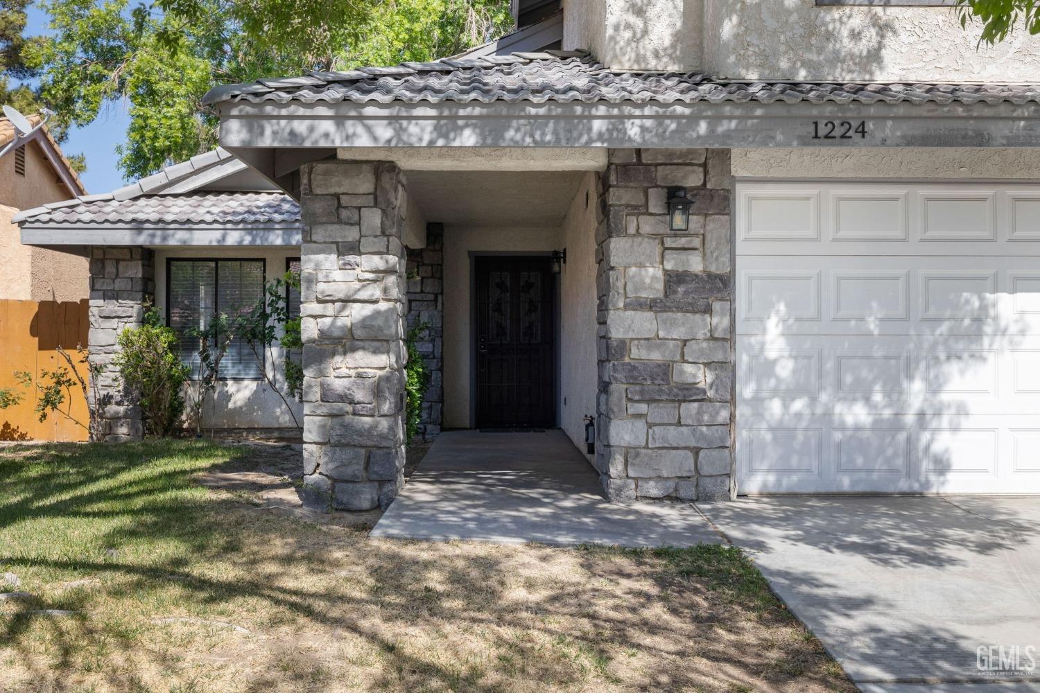 Undisclosed Address Ridgecrest, CA 93555 - Photo 4 of 34 a front view of a house with a outdoor space