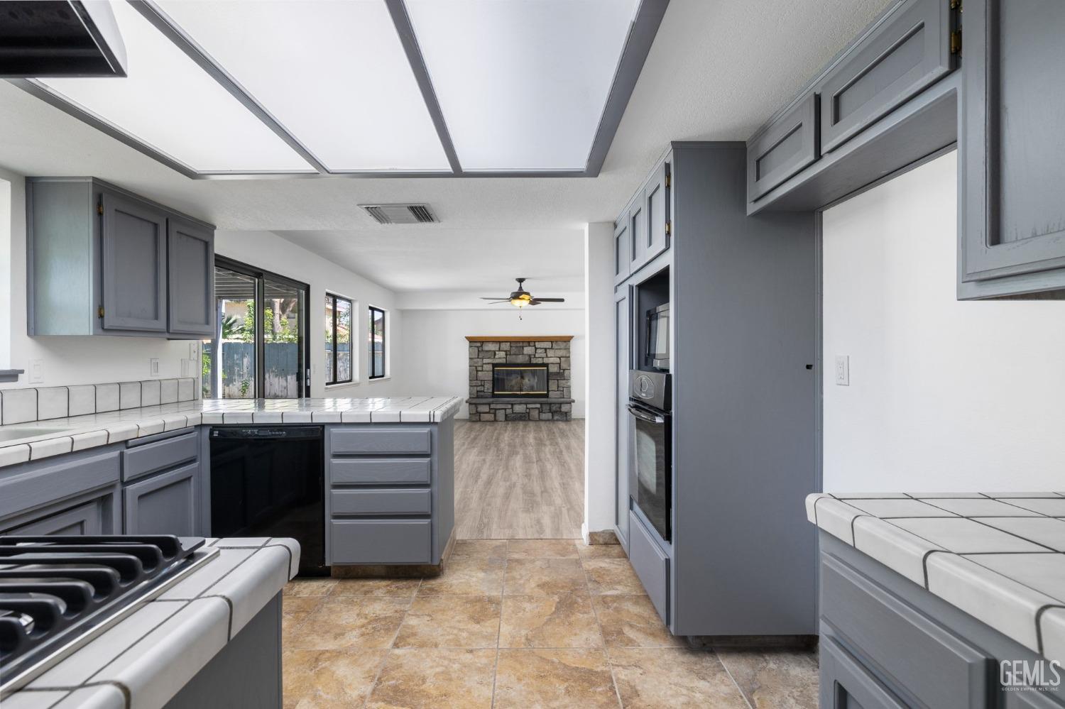 Undisclosed Address Ridgecrest, CA 93555 - Photo 10 of 34 a kitchen with a refrigerator and a stove