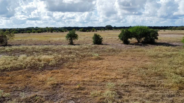 an aerial view of beach and yard