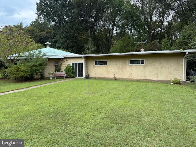 a white house that has tree in front of it