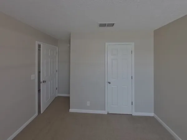 a view of hallway with closet