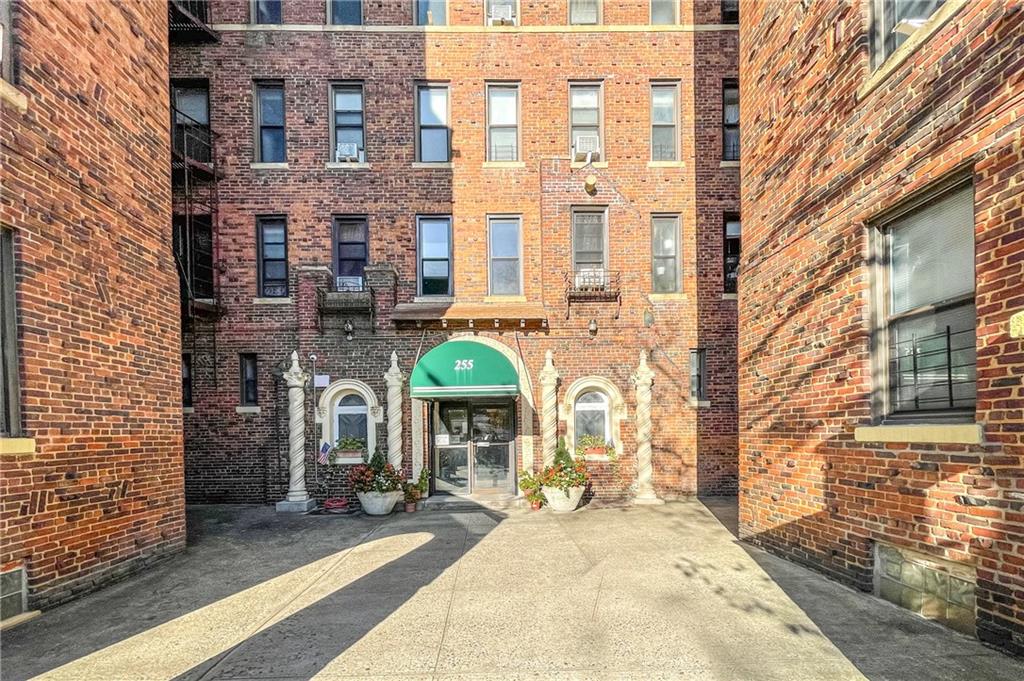 a front view of a building with glass windows