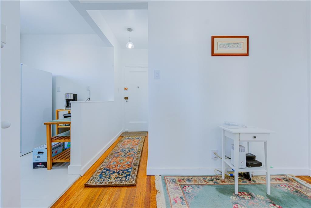 255 79th Street, Unit E11 Brooklyn, NY 11209 - Photo 17 of 34 a room with furniture and a table