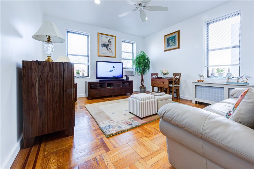 255 79th Street, Unit E11 Brooklyn, NY 11209 - Photo 8 of 34 a living room with furniture and a fireplace
