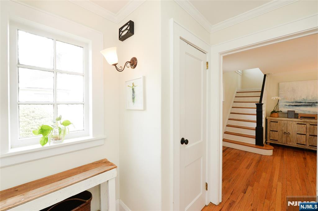 570 Shelton Road Ridgewood, NJ 07450 - Photo 2 of 26 a view of a hallway with wooden floor and windows
