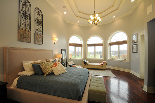 10 Ruffled Feathers Drive Lemont, IL 60439 - Photo 12 of 25 a spacious bedroom with a bed and a large mirror