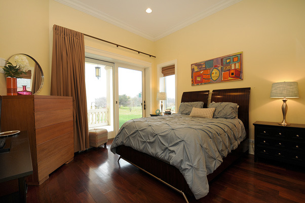 10 Ruffled Feathers Drive Lemont, IL 60439 - Photo 16 of 25 a bedroom with a bed and a large window