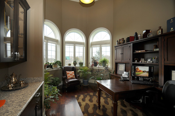 10 Ruffled Feathers Drive Lemont, IL 60439 - Photo 10 of 25 a living room with furniture and a floor to ceiling window