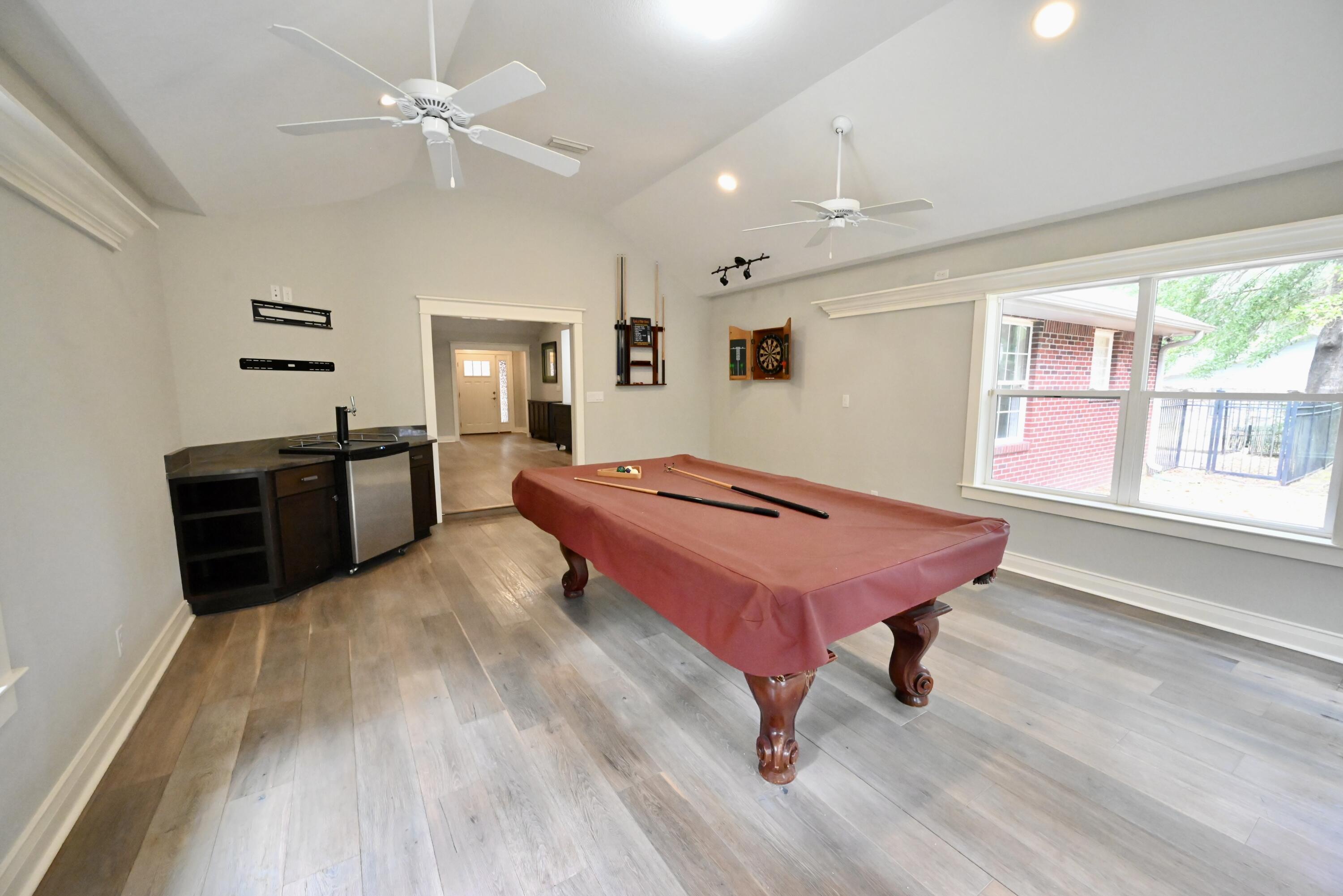 202 Shell Drive Crestview, FL 32536 - Photo 17 of 38 a bedroom with a bed and a chandelier