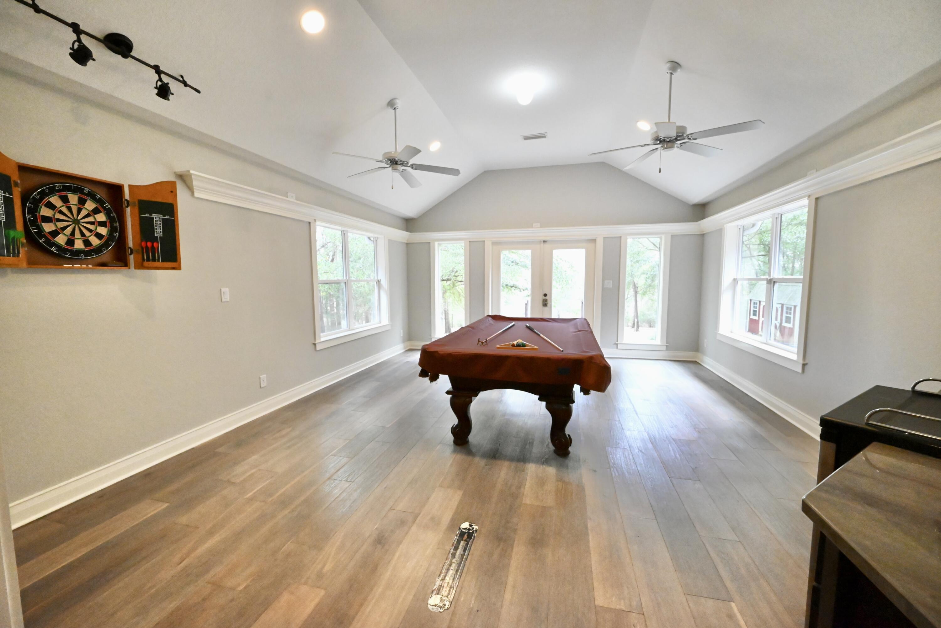 202 Shell Drive Crestview, FL 32536 - Photo 18 of 38 a living room with furniture and a wooden floor