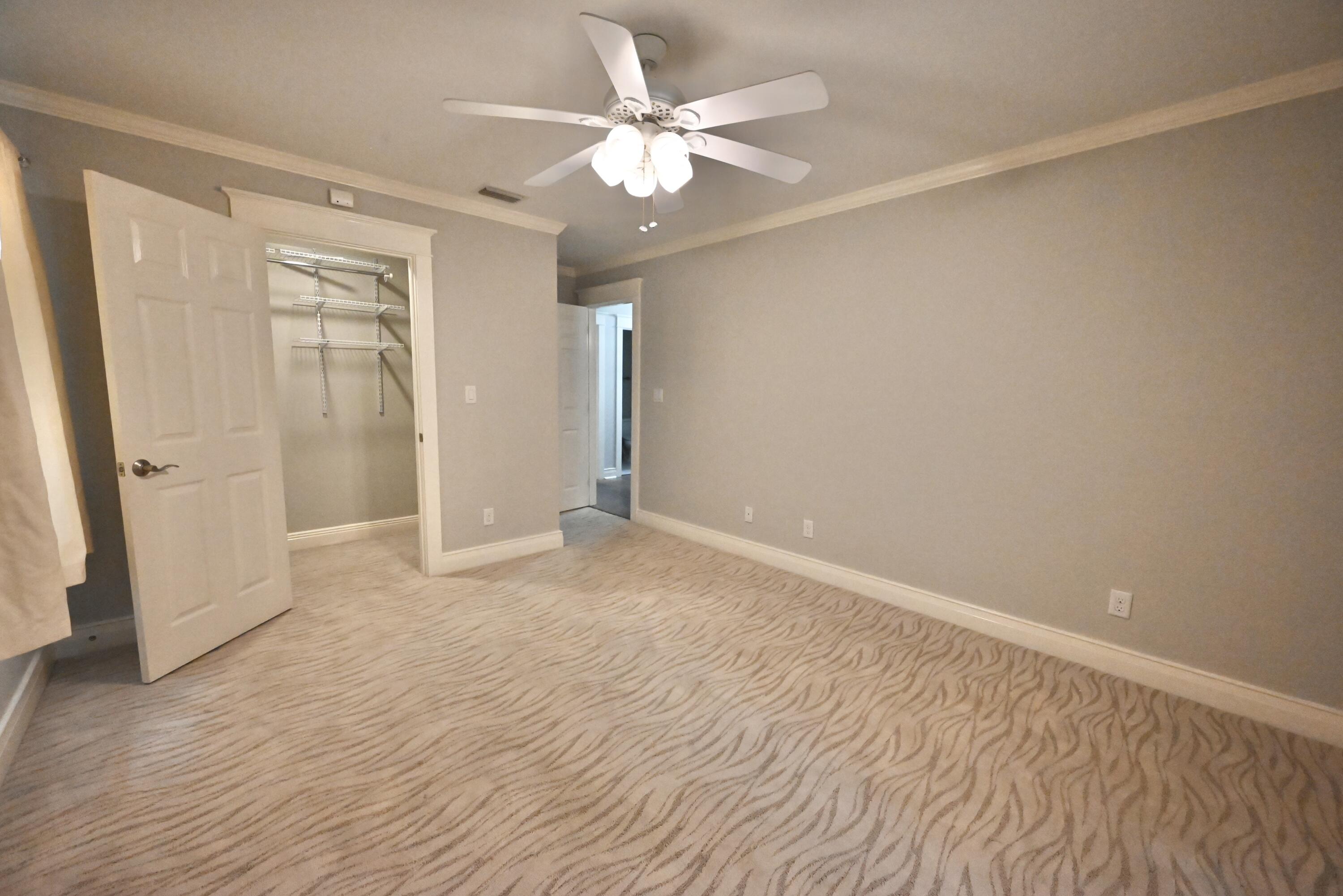 202 Shell Drive Crestview, FL 32536 - Photo 21 of 38 wooden floor in an empty room with a window