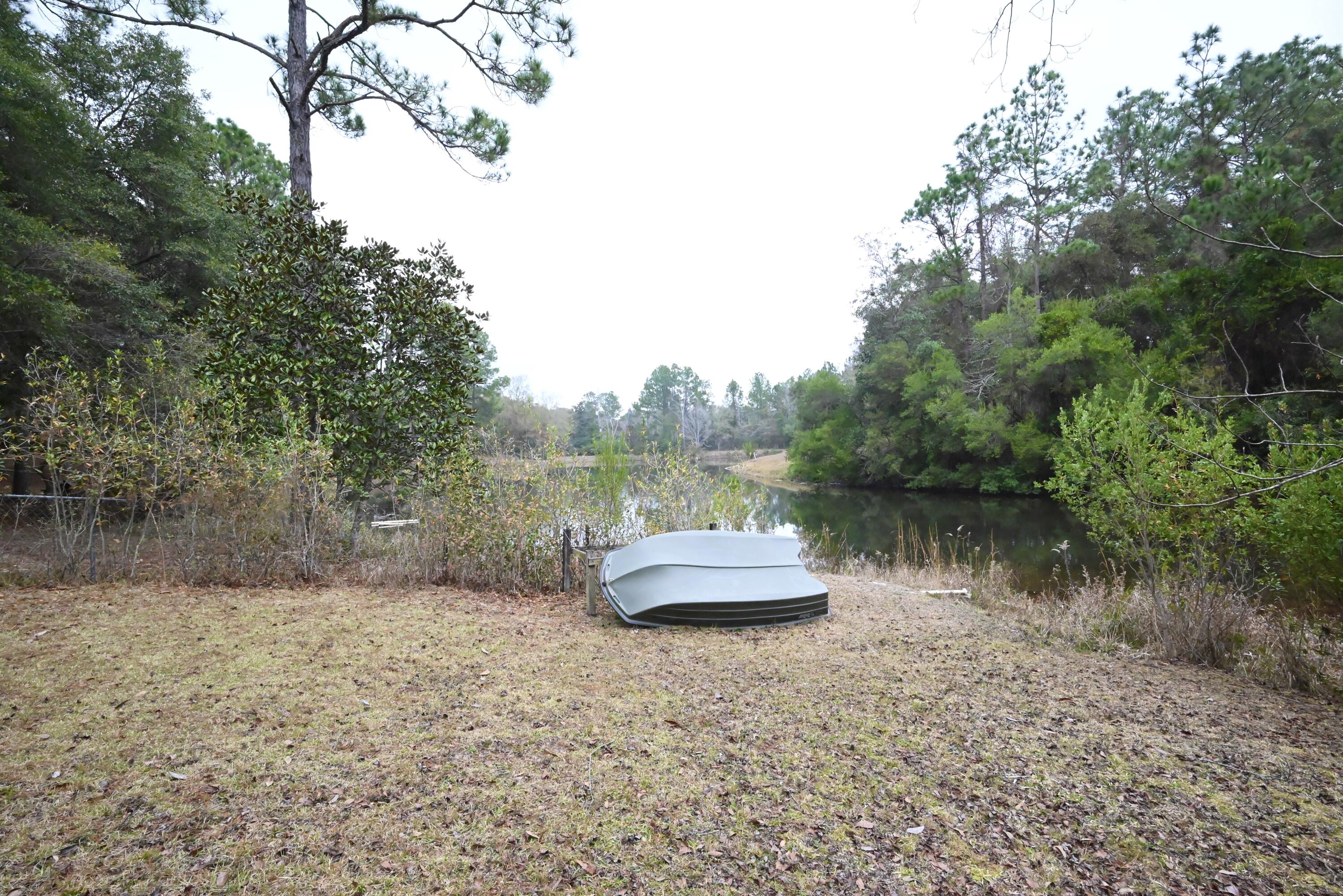 202 Shell Drive Crestview, FL 32536 - Photo 34 of 38 a view of a lake top with mountain view